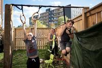 Chantalle Menard, who will be spending $350 a week on babysitters for her children to do online learning, laughs as her sons  Caeleb, 8, left, and Izek, 11, play in their backyard in Mississauga, Ont., on Friday, September 4, 2020.  Tijana Martin/ The Globe and Mail