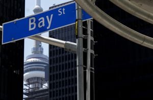 The Bay Street Financial District is shown next to the CN Tower in Toronto on Friday, Aug. 5, 2022.
