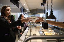 People order lunch in the newly renovated cafeteria, at Manulife headquarters in Toronto, on Tuesday March 7, 2023. (Christopher Katsarov/The Globe and Mail)