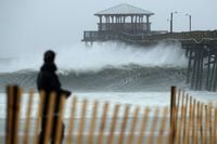 ATLANTIC BEACH, NC - SEPTEMBER 13:  Waves crash underneath the Oceana Pier as the outer bands of Hurricane Florence being to affect the coast September 13, 2018 in Atlantic Beach, United States. Coastal cities in North Carolina, South Carolina and Virginia are under evacuation orders as the Category 2 hurricane approaches the United States.  (Photo by Chip Somodevilla/Getty Images)