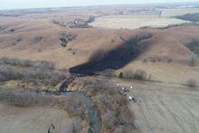 FILE PHOTO: Emergency crews work to clean up the largest U.S. crude oil spill in nearly a decade, following the leak at the Keystone pipeline operated by TC Energy in rural Washington County, Kansas, U.S., December 9, 2022.  REUTERS/Drone Base/File Photo
