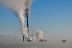 Flue gas and steam rise out of chimneys of a thermal power plant amidst heavy smog on a frosty day in the Siberian city of Omsk, Russia in February of 2023.