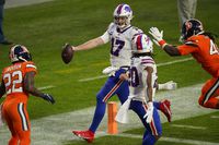 Buffalo Bills quarterback Josh Allen scores a touchdown during the second half of an NFL football game against the Denver Broncos, Saturday, Dec. 19, 2020, in Denver. (AP Photo/Jack Dempsey)