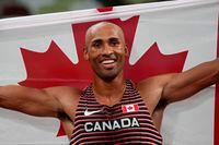Damian Warner, of Canada celebrates after he won the gold medal for the decathlon at the 2020 Summer Olympics, Thursday, Aug. 5, 2021, in Tokyo. (AP Photo/Matthias Schrader)