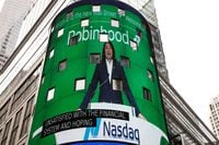 FILE PHOTO: Vlad Tenev, CEO and co-founder Robinhood Markets, Inc., is displayed on a screen during his company’s IPO at the Nasdaq Market site in Times Square in New York City, U.S., July 29, 2021.  REUTERS/Brendan McDermid/File Photo