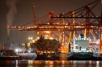 Container ships being unloaded and loaded are seen docked at port, in Vancouver, on Thursday, February 10, 2022. THE CANADIAN PRESS/Darryl Dyck