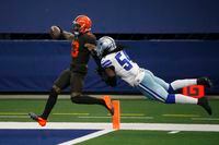 Cleveland Browns wide receiver Odell Beckham Jr. (13) scores a touchdown after a long run as Dallas Cowboys linebacker Jaylon Smith (54) attempts the stop in the second half of an NFL football game in Arlington, Texas, Sunday, Oct. 4, 2020.