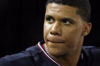 Washington Nationals' Juan Soto stands in the dugout in the seventh inning of a baseball game against the St. Louis Cardinals, Friday, July 29, 2022, in Washington. (AP Photo/Patrick Semansky)