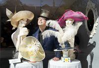 David Dunkley, a Toronto milliner who specializes in making couture hats, poses for a photograph in Toronto on Wednesday, April 26, 2023. Dunkley is heading to London next week for coronation-related events and parties with his hats. THE CANADIAN PRESS/Nathan Denette