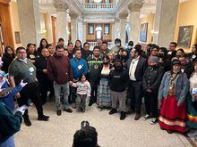 Neskantaga Chief Wayne Moonias, centre in green, speaks alongside First Nations community members during an improvised press conference inside the Ontario Legislature, at Queen's Park, in Toronto, Wednesday, March 29, 2023. Moonias was one of two First Nation leaders who were kicked out of Ontario's legislature for shouting at Premier Doug Ford to meet with them over mining concerns on their lands in the "Ring of Fire" region. THE CANADIAN PRESS/Allison Jones