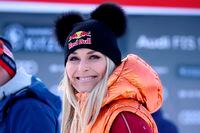 FILE- In this Friday, Jan. 24, 2020, file photo, Former ski star Lindsey Vonn, of United States, smiles in the finish area during the men’s World Cup super G alpine ski race in Kitzbuehel, Austria. Vonn, the winningest woman in World Cup history, is scheduled to call the women’s downhill and super-G races in Crans Montana, Switzerland, this weekend for NBC Sports. (AP Photo/Marco Trovati, File)