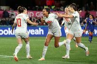 Switzerland's Ramona Bachmann, left, celebrates with Coumba Sow (11) after scoring a penalty kick in the first half of the Group A Women's World Cup soccer match between the Philippines and Switzerland in Dunedin, New Zealand, Friday, July 21, 2023. (AP Photo/Matthew Gelhard)