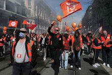 CFDT unionists take part in a demonstration after the government pushed a pensions reform through parliament without a vote, using the article 49.3 of the constitution, in Nice, southern France, on March 28, 2023. - France faces another day of strikes and protests nearly two weeks after the president bypassed parliament to pass a pensions overhaul that is sparking turmoil in the country, with unions vowing no let-up in mass protests to get the government to back down. The day of action is the tenth such mobilisation since protests started in mid-January against the law, which includes raising the retirement age from 62 to 64. (Photo by Valery HACHE / AFP) (Photo by VALERY HACHE/AFP via Getty Images)