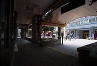 Cyclists ride their bikes past empty shops in Whistler, B.C., Friday, May 15, 2020. Whistler which is a travel destination for tourists around the world is seeing the effects of travel bans due to COVID-19.