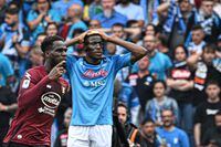 Salernitana's Senegalese forward Boulaye Dia (L) celebrates past Napoli's Nigerian forward Victor Osimhen after scoring an equalizer during the Italian Serie A football match between Napoli and Salernitana on April 30, 2023 at the Diego-Maradona stadium in Naples. - Naples braces for its potential first Scudetto championship win in 33 years. With a 17 point lead at the top of Serie A, southern Italy's biggest club is anticipating its victory in the Scudetto for the first time since 1990. (Photo by Filippo MONTEFORTE / AFP) (Photo by FILIPPO MONTEFORTE/AFP via Getty Images)