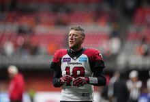Calgary Stampeders quarterback Bo Levi Mitchell warms up before the CFL western semi-final football game against the B.C. Lions in Vancouver on Sunday, November 6, 2022. The Hamilton Tiger-Cats announced Tuesday that Mitchell has signed a three-year deal with the club. THE CANADIAN PRESS/Darryl Dyck