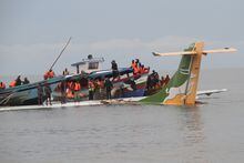 Rescuers search for survivors after a Precision Air flight that was carrying 43 people plunged into Lake Victoria as it attempted to land in the lakeside town of Bukoba, Tanzania on November 6, 2020. - Three people died in the accident according to local rescue services. (Photo by SITIDE PROTASE / AFP) (Photo by SITIDE PROTASE/AFP via Getty Images)
