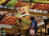 A woman browses in the fruit section of a Loblaw supermarket in Collingwood, Ont., on July 28, 2017.