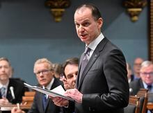 Quebec Finance Minister Eric Girard reads his budget speech, Tuesday, March 21, 2023 at the legislature in Quebec City. THE CANADIAN PRESS/Jacques Boissinot