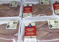 Maple Leaf Foods Inc. reported a fourth-quarter loss of $9.3 million compared with a loss of $41.5 million a year earlier. Packages&nbsp;of Maple Leaf Foods chicken breasts are shown on a shelf at a grocery store in Oakville, Ont., Friday, Jan.6, 2023. THE CANADIAN PRESS/Richard Buchan