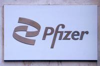 FILE PHOTO: Pfizer logo seen outside their building in Manhattan, New York City, New York, U.S., March 2, 2021. REUTERS/Carlo Allegri/File Photo