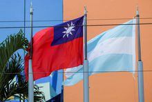 FILE PHOTO: The flags of Taiwan and Honduras flutter in the wind outside the Taiwan Embassy in Tegucigalpa, Honduras March 15, 2023. REUTERS/Fredy Rodriguez/File Photo