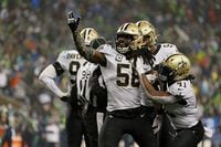 SEATTLE, WASHINGTON - OCTOBER 25:  Demario Davis #56 of the New Orleans Saints reacts to a defensive stop during the second half against the Seattle Seahawks at Lumen Field on October 25, 2021 in Seattle, Washington. (Photo by Steph Chambers/Getty Images)