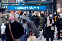 FILE PHOTO: People with protective face masks walk at Kurfurstendamm shopping boulevard, amid the coronavirus disease (COVID-19) outbreak in Berlin, Germany, December 5, 2020. REUTERS/Fabrizio Bensch