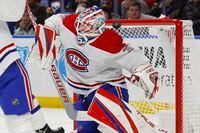 Montreal Canadiens goaltender Sam Montembeault (35) makes a save during the first period of an NHL hockey game against the Buffalo Sabres, Thursday, Oct. 27, 2022, in Buffalo, N.Y. (AP Photo/Jeffrey T. Barnes)