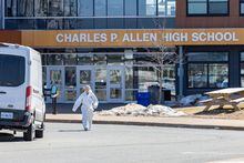 Forensics on the scene at Charles P. Allen High School in Halifax, Monday, March 20, 2023. The Halifax school where two staff were stabbed on Monday is reopening today with counselling being provided.THE CANADIAN PRESS/Riley Smith