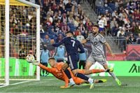 Sep 17, 2022; Foxborough, Massachusetts, USA; CF Montreal goalkeeper Sebastian Breza (1) stops a shot from New England Revolution forward Gustavo Bou (7) during the second half at Gillette Stadium. Mandatory Credit: Eric Canha-USA TODAY Sports