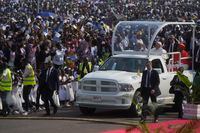 Pope Francis on the popemobile arrives at Ndolo airport where he will preside over the Holy Mass in Kinshasa, Congo, Wednesday Feb. 1, 2023. Francis is in Congo and South Sudan for a six-day trip, hoping to bring comfort and encouragement to two countries that have been riven by poverty, conflicts and what he calls a "colonialist mentality" that has exploited Africa for centuries. (AP Photo/Gregorio Borgia)