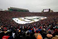 FILE - In this Jan. 1, 2019, file photo, the Boston Bruins and the Chicago Blackhawks play in the NHL Winter Classic hockey game at Notre Dame Stadium in South Bend, Ind. Outdoor games have become the the marquee event of the NHL season ever since the league staged the first Winter Classic in Buffalo in 2008. None of the 30 previous outdoor games had quite a setup like this season when the league will stage two games this weekend on the 18th fairway of a golf course on the shores of Lake Tahoe, with the Sierra Nevada Mountains towering in the background. (AP Photo/Nam Y. Huh, File)