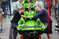 Employees work on the Sea-Doo assembly line at the BRP plant on June 12, 2014 in Valcourt, Que.