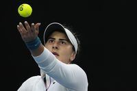 Bianca Andreescu of Canada serves to Cristina Bucsa of Spain during their second round match at the Australian Open tennis championship in Melbourne, Australia, Wednesday, Jan. 18, 2023. (AP Photo/Ng Han Guan)