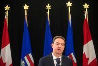 Alberta's Health Minister Jason Copping gives an update in Edmonton, Tuesday, Sept. 21, 2021. Copping says he is not pursuing user-pay changes to the publicly funded system, but the Opposition NDP says Premier Danielle Smith needs to be clear on that. THE CANADIAN PRESS/Jason Franson