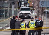 Police are seen near a damaged van in Toronto after a van mounted a sidewalk crashing into a number of pedestrians on Monday, April 23, 2018. Some experts say violent online rhetoric among so-called involuntary celibates is a concern as pandemic rules lift, but others say the threat of violence is overstated among a group of men who need mental health support. THE CANADIAN PRESS/Aaron Vincent Elkaim