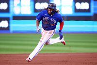 TORONTO, ON - AUGUST 30:  Vladimir Guerrero Jr. #27 of the Toronto Blue Jays runs to third base on a double by Bo Bichette in the first inning against the Chicago Cubs at Rogers Centre on August 30, 2022 in Toronto, Ontario, Canada.  (Photo by Vaughn Ridley/Getty Images)