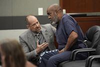 Duane "Keffe D" Davis, right, speaks with attorney Ross Goodman in court Thursday, Oct. 19, 2023, in Las Vegas. Davis has been charged with killing Tupac Shakur in 1996. (AP Photo/John Locher, Pool)