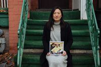 Sandra Kang, holding a photo of her grandfather, Jong Kil Kim, poses for a portrait in front of her home in Toronto, Thursday, December 10, 2020. Kang started a petition to oppose the purchase of The Rose of Sharon Korean Long Term Care Home, where her grandfather resides, by Rykka, a for-profit  company that owns nursing homes hit hard by the coronavirus. (Galit Rodan/The Globe and Mail)