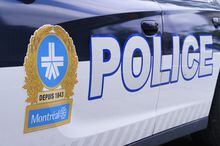 The Montreal police logo is seen on a police car in Montreal on Wednesday, July 8, 2020. Montreal police say several search and seizures are underway in connection with a homicide in the city's east end last month. THE CANADIAN PRESS/Paul Chiasson