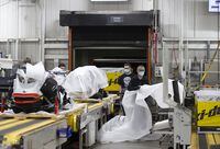 Ski-doos are packaged and boxed on the assembly line making snowmobiles at BRP Inc., in Valcourt, Quebec, October 8, 2020.   (Christinne Muschi /The Globe and Mail)