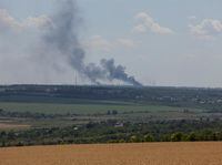 FILE PHOTO: Vuhlehirsk's heat power plant burns in the distance after a shelling, amid Russia's attack on Ukraine, near the town of Svitlodarsk, Donetsk region, Ukraine July 13, 2022. REUTERS/Gleb Garanich