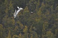 The Transportation Safety Board of Canada is sending a team of investigators to the scene of a seaplane accident that killed four people and left five injured on a remote, uninhabited island in British Columbia on Friday. A plane's fuselage is seen through the canopy of forest at a crash site on Addenbroke Island, B.C., in a July 26, 2019, aerial handout photo. THE CANADIAN PRESS/HO-Royal Canadian Air Force, 442 Sqn., *MANDATORY CREDIT*