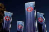 FILE PHOTO: Flags with UEFA logo are seen outside of the Union of European Football Associations headquarters in Nyon, Switzerland, October 5, 2022. REUTERS/Denis Balibouse/File Photo
