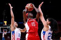Canada's Laeticia Amihere drive to the basket under the pressure from Puerto Rico's Isalys Quinones (R) and Arella Guirantes (L) during the 2022 Women's Basketball World Cup quarter-final match between Puerto Rico and Canada at Sydneydome on September 29, 2022, in Sydney. (Photo by WILLIAM WEST / AFP) / -- IMAGE RESTRICTED TO EDITORIAL USE - STRICTLY NO COMMERCIAL USE -- (Photo by WILLIAM WEST/AFP via Getty Images)