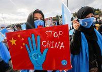FILE PHOTO: Ethnic Uighur demonstrators take part in a protest against China, in Istanbul, Turkey, October 1, 2021. REUTERS/Dilara Senkaya/File Photo