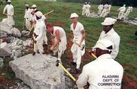 Prisoners at the Limestone County Correctional Facility participating in the Chain-Gang program use sledge hammers to crush rocks as part of a new get-tough regime near Huntsville, Ala., on Aug. 21, 1995. The U.S. Justice Department painted a harrowing picture on April 3, 2019 of conditions in men's prisons in the southern state of Alabama including "regular" violence, drug use, sexual abuse and inmate deaths.