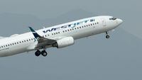 A WestJet plane takes off from Vancouver International Airport in Vancouver on Monday, May 13, 2019. Onex Corp. has signed a friendly deal to buy WestJet Airlines Ltd. in a transaction it valued at $5 billion, including assumed debt. THE CANADIAN PRESS/Jonathan Hayward