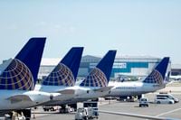 United Airlines commercial jets sit at a gate at Terminal C of Newark Liberty International Airport, in Newark, N.J., in a July 18, 2018, file photo.